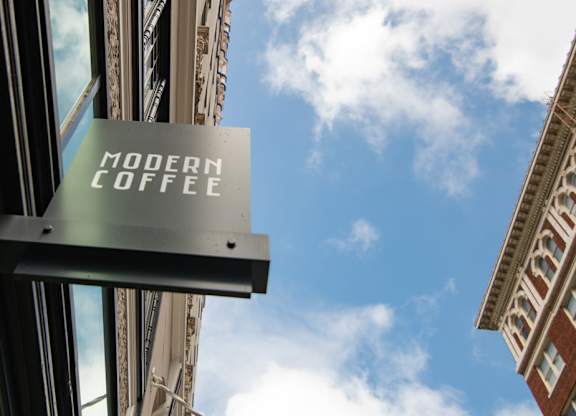 A sign that says Modern Coffee