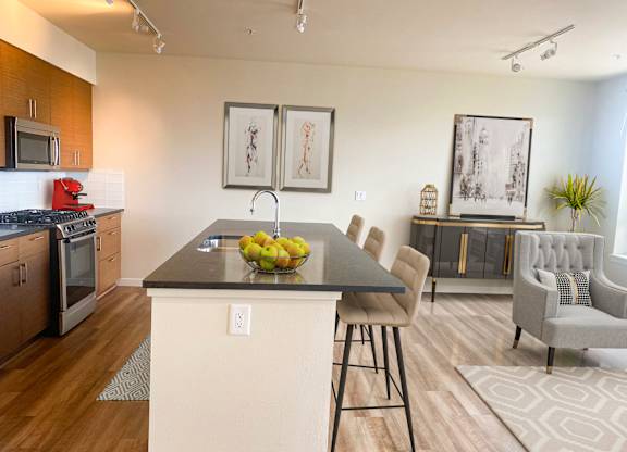 Modern kitchen island with seating area at Axis Seattle Apartments, Seattle, Washington