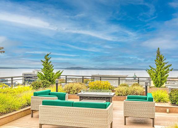 Rooftop terrace with seating and water view at Axis Seattle Apartments, Seattle, Washington