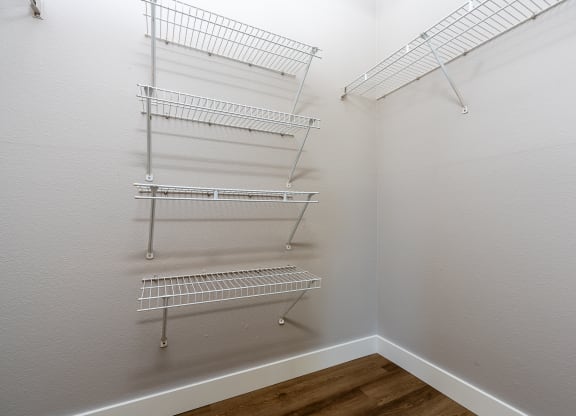 our spacious closets are equipped with shelves and hooks for hanging clothes