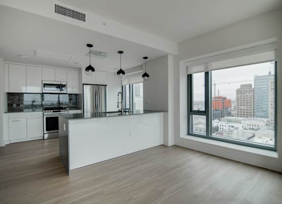 A modern kitchen with a view of the city.