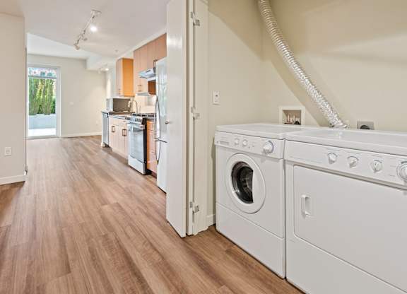 In unit washer and dryer in closet at Axis Seattle Apartments, Seattle