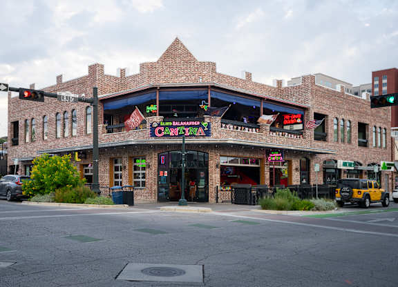 A street view of a building with a sign that says