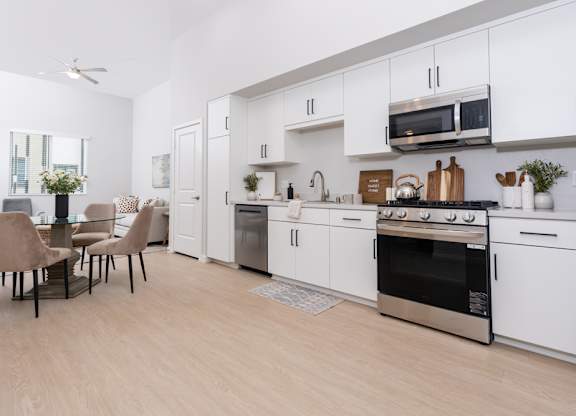 Living room with Kitchen with stainless steel appliances