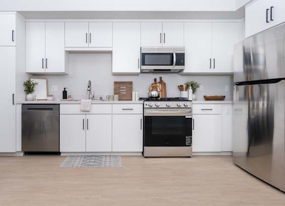 Kitchen with white cabinets and stainless steel appliances