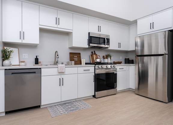 Kitchen with white cabinet and stainless steel appliances