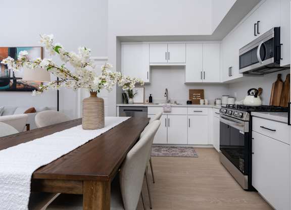 Kitchen with white cabinets and stainless steel appliances