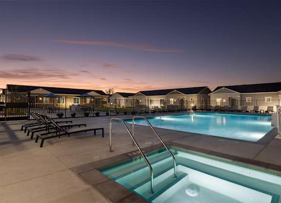 A swimming pool with a slide in the middle of it.