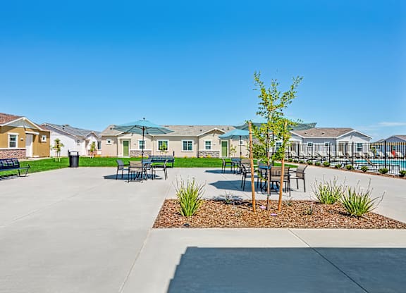 A sunny day at a residential complex with a clear blue sky.