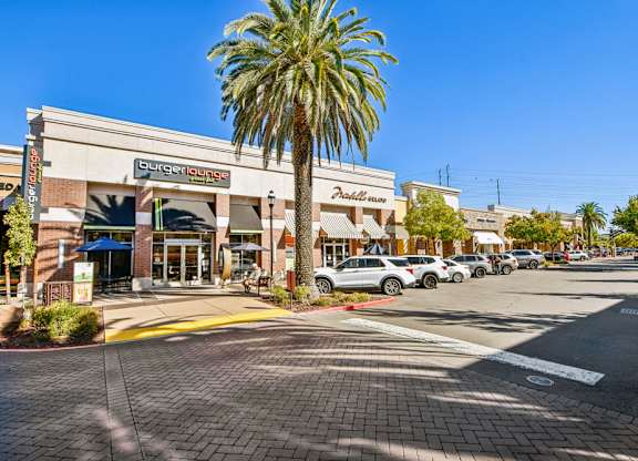 A Burger Lounge is located in a strip mall.