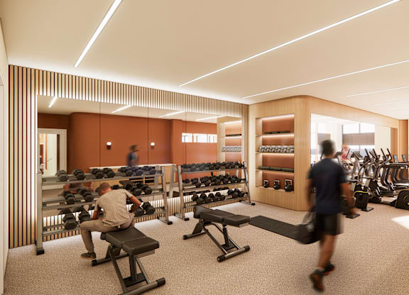 A gym with people working out and various equipment.