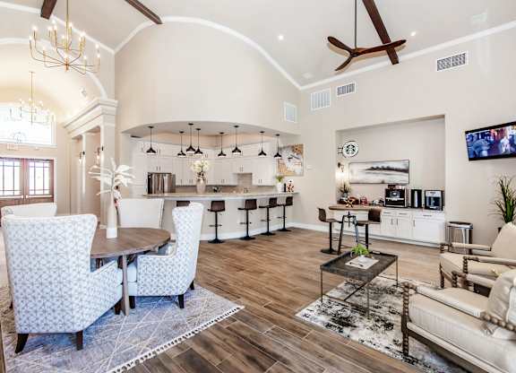 A living room with a dining table and chairs.