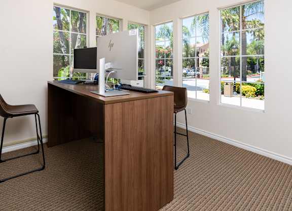 A room with a desk and a chair.