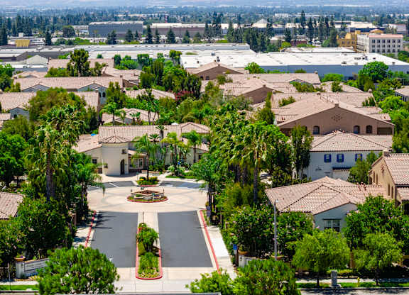 A view of a residential area with houses and trees.