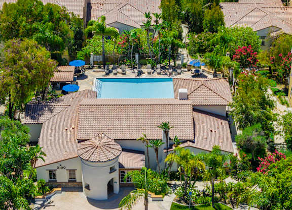 A large outdoor swimming pool surrounded by a circular walkway.