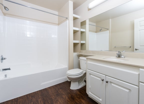 a bathroom with a bathtub toilet and sink