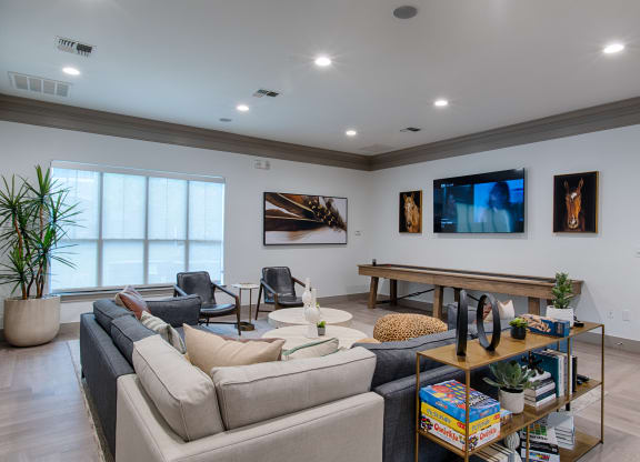 Community Clubhouse With TV, Seating area with couch at Silverado, Frisco, 75034