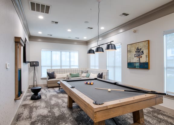 Billiards Table In Clubhouse with wide windows at Silverado, Frisco, TX, Texas