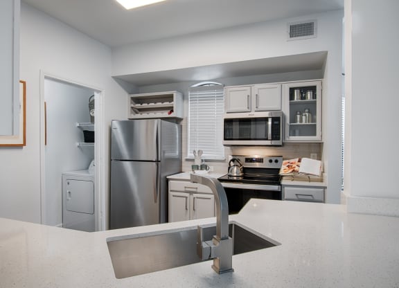 Kitchen With White Cabinetry And Appliances at Silverado, Frisco
