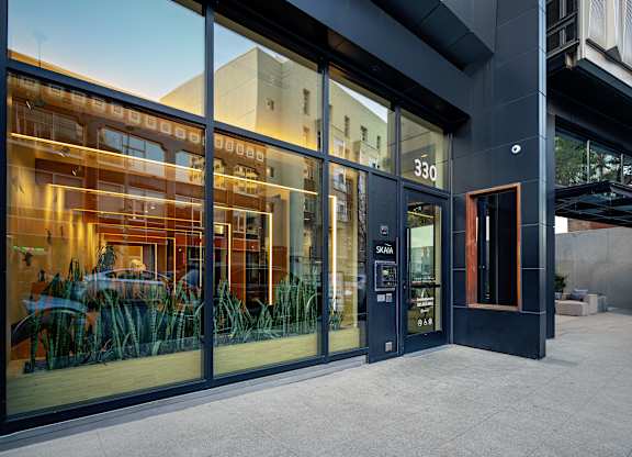 A modern building with glass doors and windows.