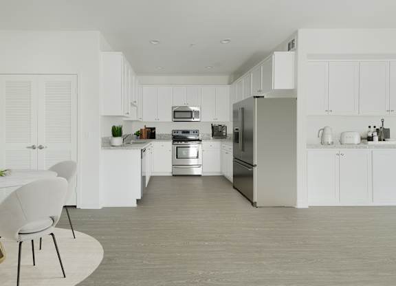 A modern kitchen with white cabinets and stainless steel appliances.at 422 South Lake, California  