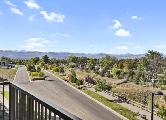 the view from the balcony overlooking the street and mountains at Parkside at Littleton Village, Littleton, Colorado