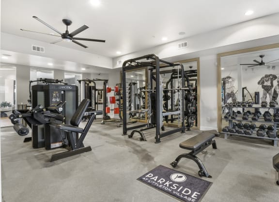 a home gym with weights and cardio machines and a ceiling fan at Parkside at Littleton Village, Colorado