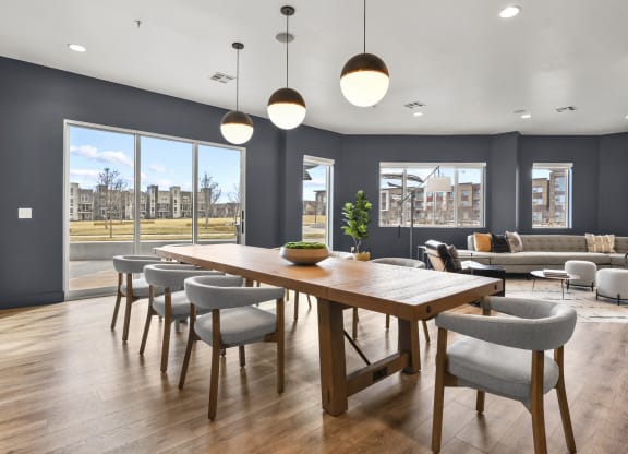 a dining room with a wooden table and chairs at Parkside at Littleton Village, Littleton, 80122