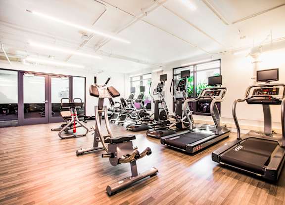 A gym with treadmills, exercise bikes, and other equipment.at The Rise, San Francisco California  