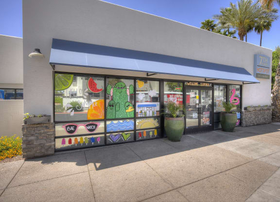 the outside of a store with a window display of fruit and vegetables at Vaseo Apartments, Arizona