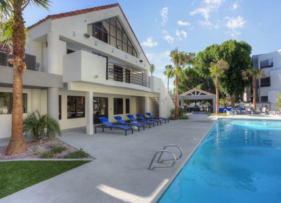 a house with a swimming pool in front of it at Vaseo Apartments, Phoenix, AZ