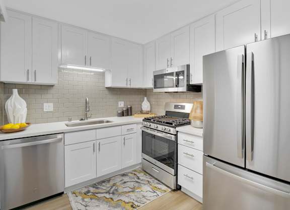 A modern kitchen with stainless steel appliances at Verandas Apartments, California