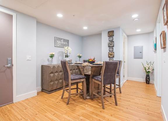 A dining room with a wooden table and chairs at Woodley Sara Apartment, Van Nuys, CA