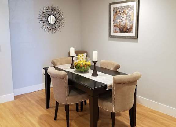 A dining room with a table set for two at Woodley Sara Apartment, Van Nuys, 91406