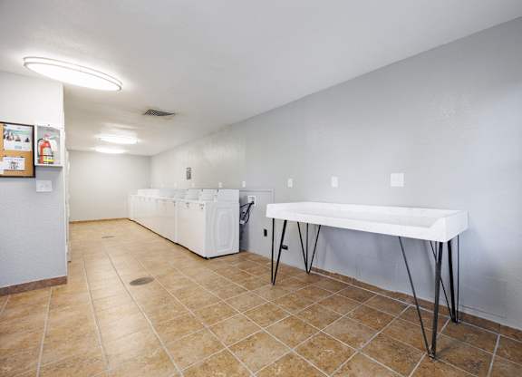 A room with a table and chairs in it.