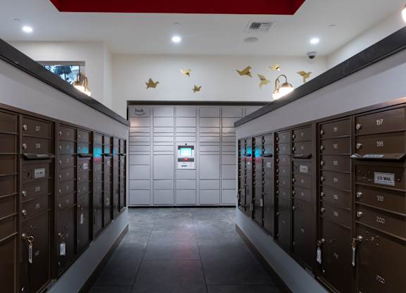 A row of brown lockers with numbers on them.