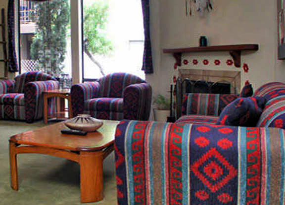 A living room with a fireplace and a couch.