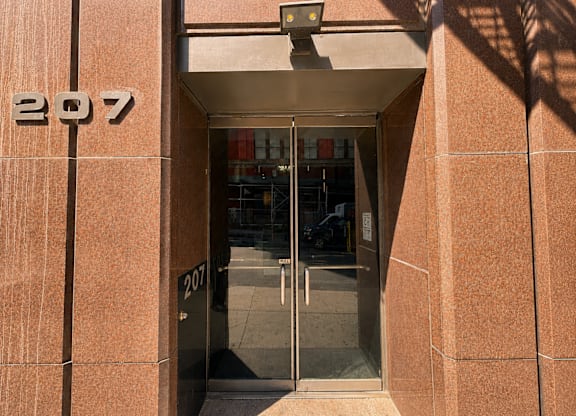 The number 207 is displayed on a building.