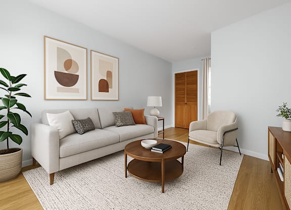 A living room with a couch, chair, and coffee table.
