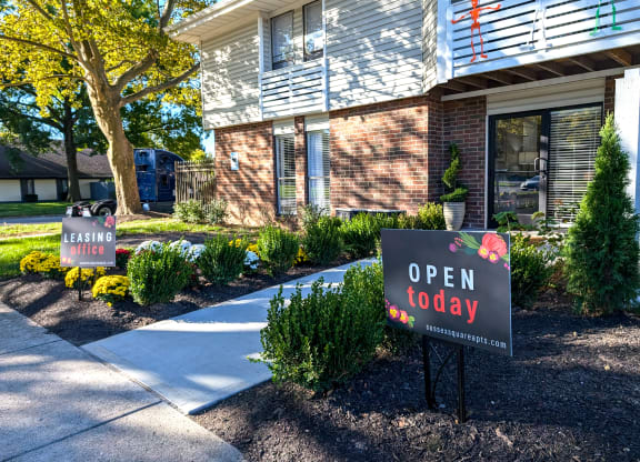 an open today sign in front of a house