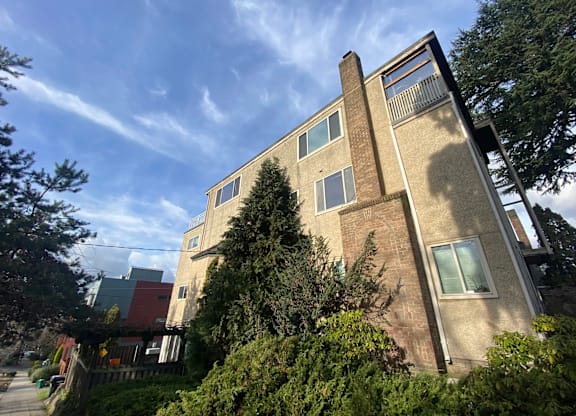 A modern house with a flat roof and large windows.