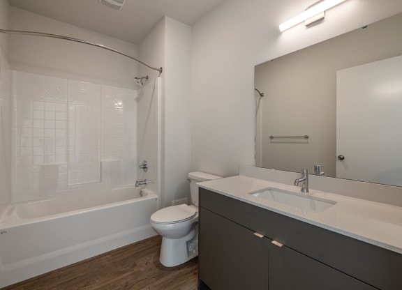 a bathroom with a sink toilet and a tub at Sagecrest Apartments, Wenatchee