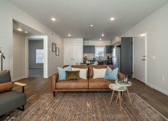a living room with a couch and a coffee table at Sagecrest Apartments, Wenatchee, 98801