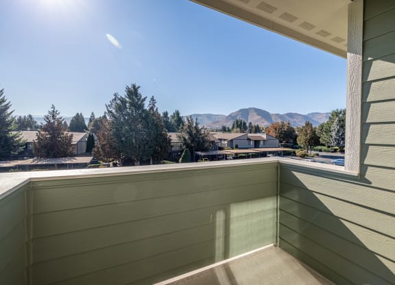 the view from the balcony of a condo with a large window at Sagecrest Apartments, Wenatchee, Washington