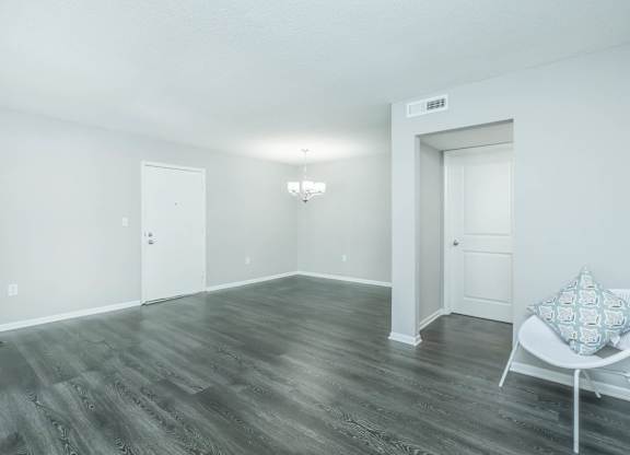 A room with a chair and a pillow on it at Crest at East Cobb Apartments, Marietta, GA