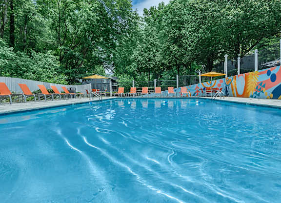 A swimming pool with a mural on the side at Crest at East Cobb Apartments, Georgia, 30062