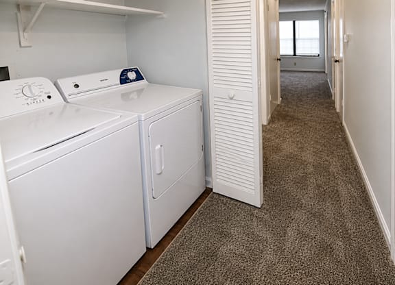 A laundry room with a washer and dryer.