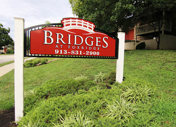 A red sign with white lettering that says "Bridges" on it.