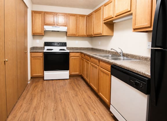 Kitchen with cabinets at Cottages of Topeka, Kansas, 66608