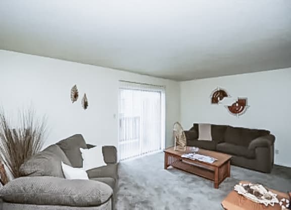a living room with two couches and a coffee table at Gatehouse Apartments, Missouri, 64134